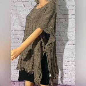 Women’s brown poncho sweater with fringe on the bottom